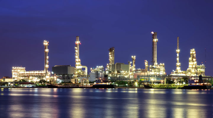 Oil Refinery Twilight With Reflection